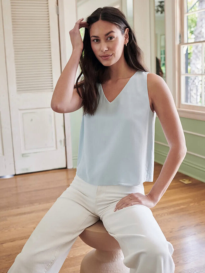 Ethically Made Workwear for Women: Quince's pale blue silk top and white trousers