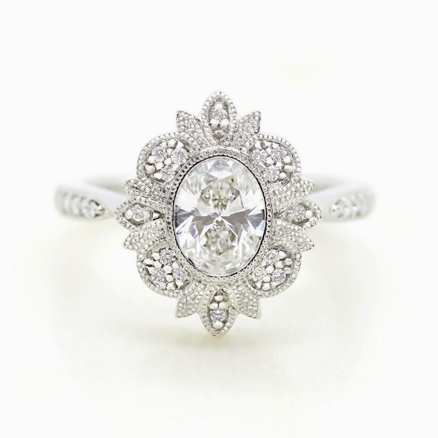 oval-centre-diamond-engagement-ring-with-milgrain-bead-set-halo-detail-1000x1000.jpg